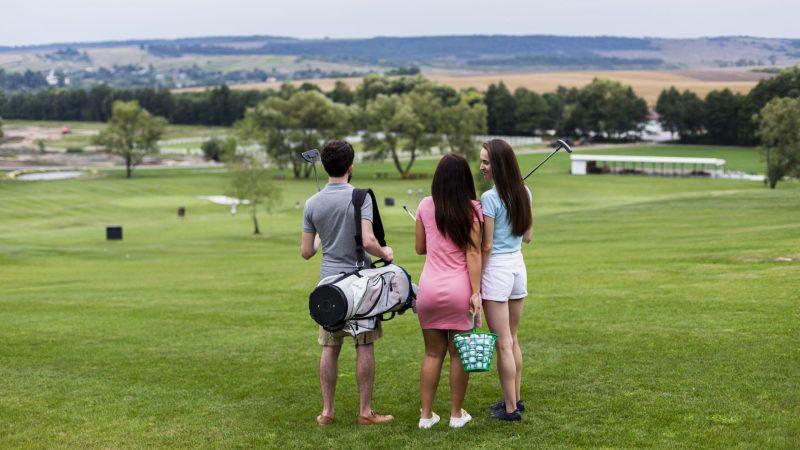 back-view-of-friends-at-the-golf-course
